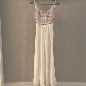 White maxi dress with embroidered design